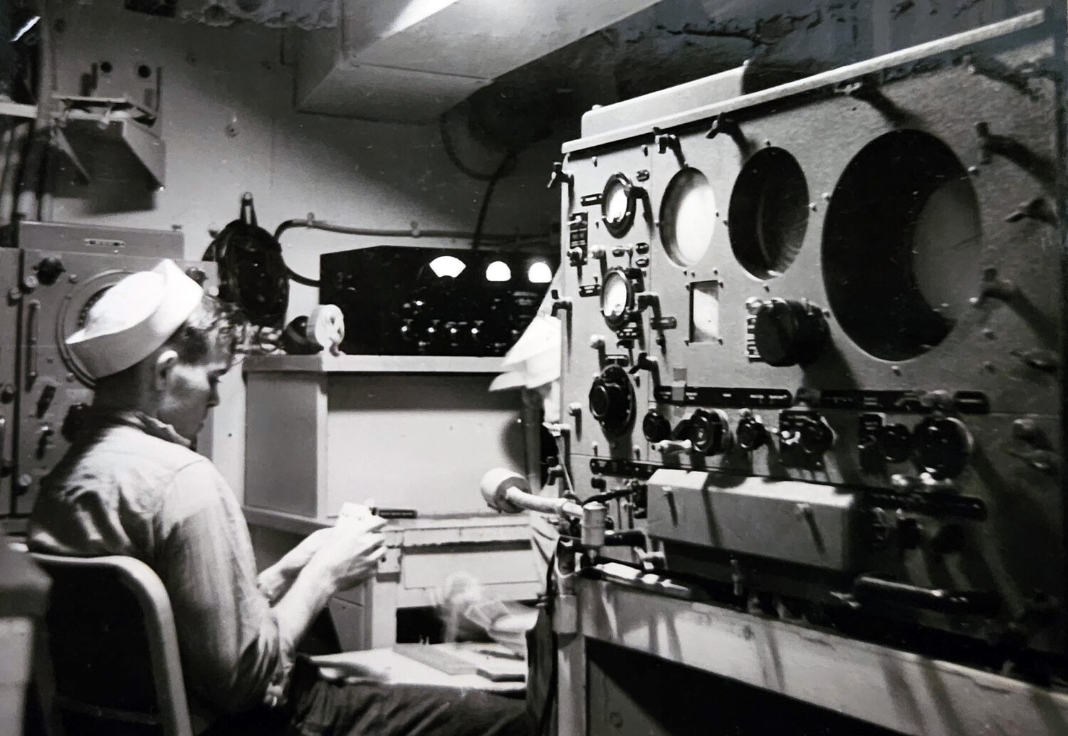 Bill Murdock is pictured working as a radar operator in the U.S. Navy.